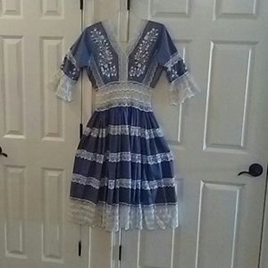 Chambray blue dress trimmed in white lace. Made in